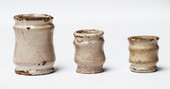 Three Delft white 17th C. albarello ointment jars.