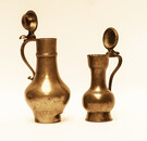 Two 18th Century toy pewter lid jugs with hallmarks.