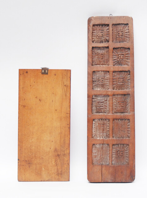 Two Dutch wooden cooky moulds, one of which with Saint Nicholas.