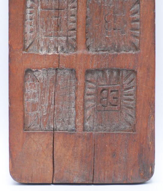 Two Dutch wooden cooky moulds, one of which with Saint Nicholas.