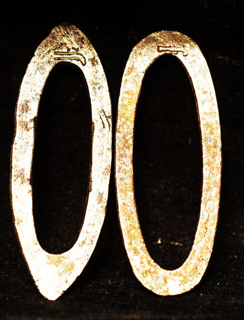 Two flint irons with a blacksmiths touch mark of a pistol.